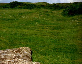 Shallow depression marks the line of the path shown on the map and the probable route of the tramway from the road.